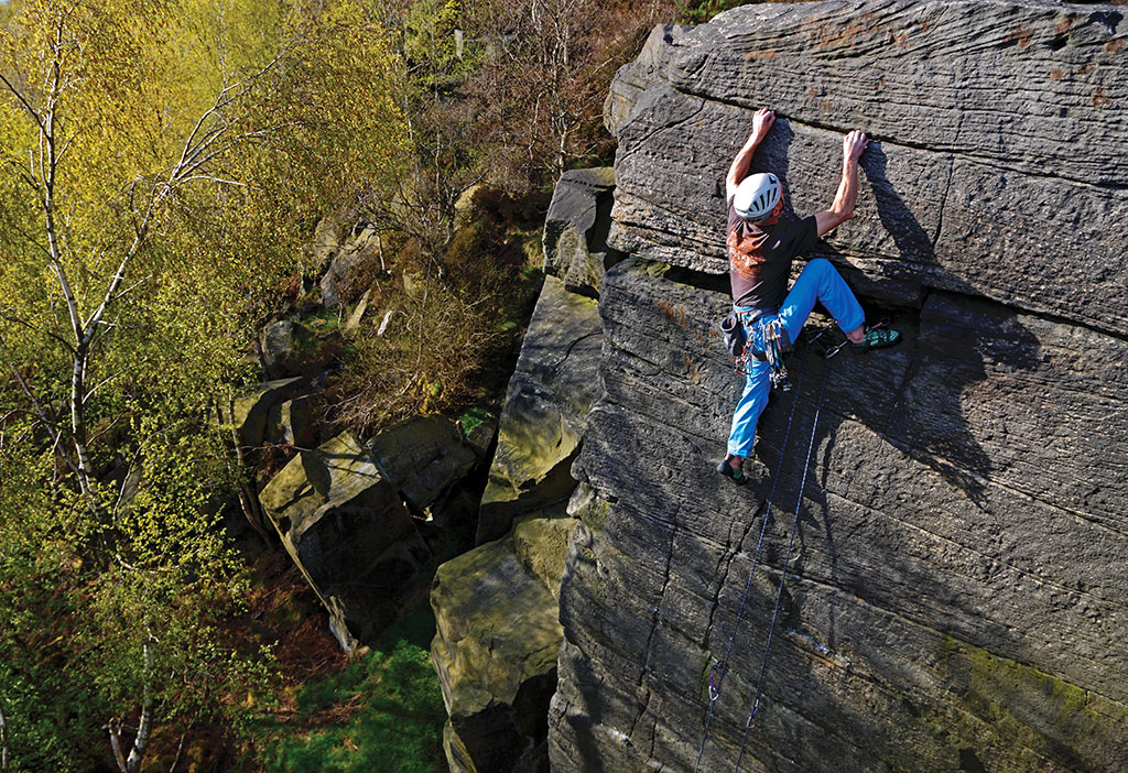 Well worth the walk and perhaps the best harder route on the edge. Chris Hindley makes the committing moves on Autumn Wall (E4 6a) in the Long John’s Stride area. Photo: © David Simmonite